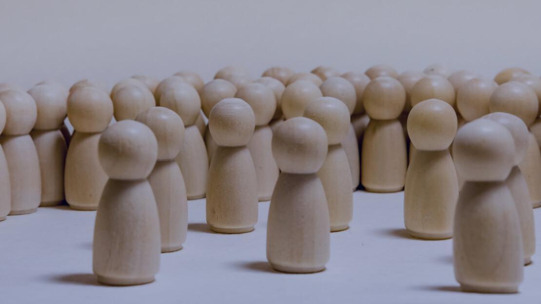 What kind of leader are you? Image of wooden people in a group.