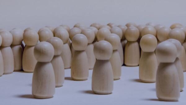 What kind of leader are you? Image of wooden people in a group.